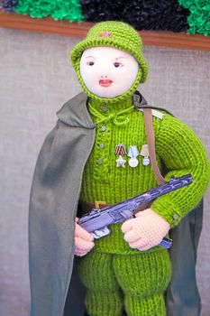 Crafts: crochet figurine of a female soldier.