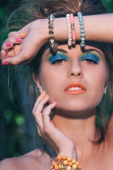 Girl with makeup and handmade bracelets