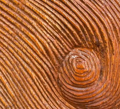 Carved Whirlpool on Wood Texture Background