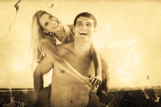 Composite image of laughing man giving his pretty girlfriend a piggy back smiling 
