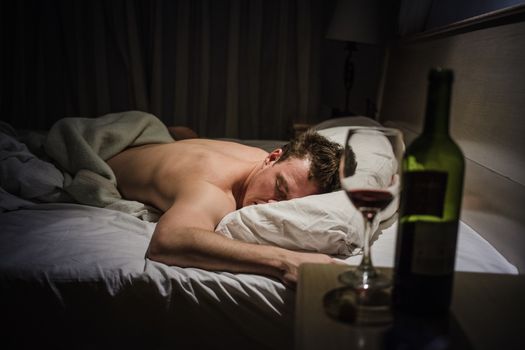 Lonely Drunk Man Sleeping After a Bottle of Wine.