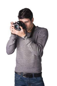 Handsome young male photographer taking photograph