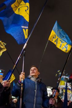 Maidan - young activist with flag of nationalistic party svoboda