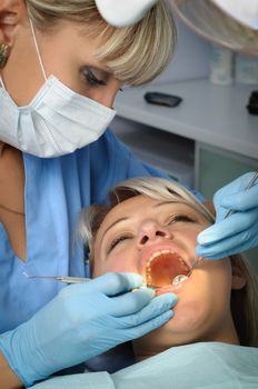 dentist with patient, dental calculus removal