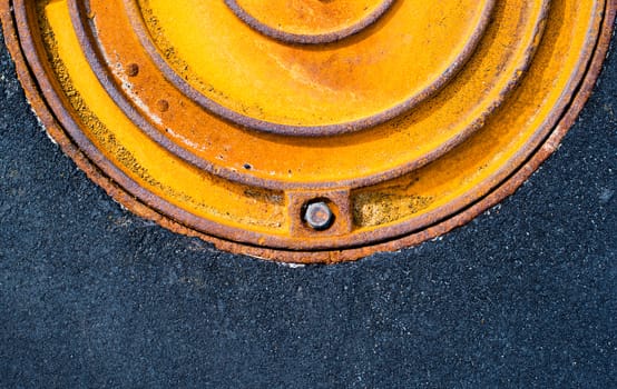 Rusty metal manhole cover