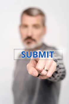 Man pressing virtual submit button