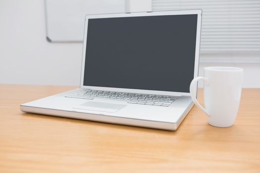 A desk with a computer