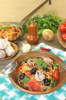 Spaghetti alla puttanesca with olives and capers