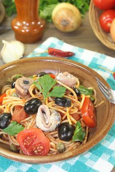 Spaghetti alla puttanesca with olives and anchovies