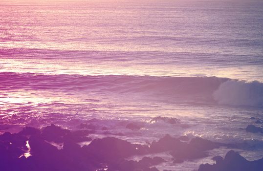 Retro summer beach breaking waves at sunrise 