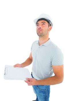 Manual worker looking up while holding clipboard