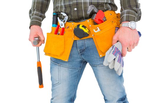 Manual worker holding gloves and hammer