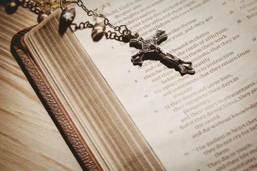 Open bible and silver crucifix