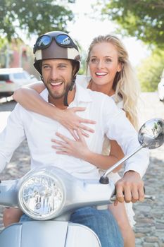 Attractive couple with their scooter