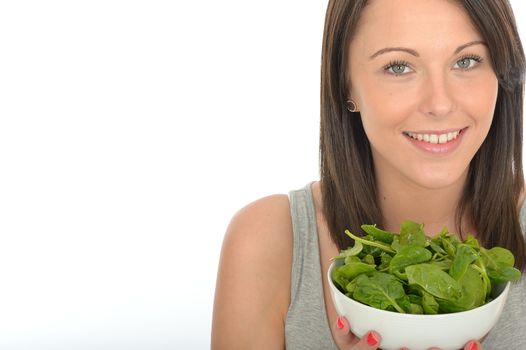 Attractive Healthy Young Woman Holding A Fresh Bowl of Spinach Leaves