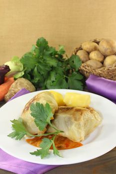 Cabbage roulade with potatoes and sauce