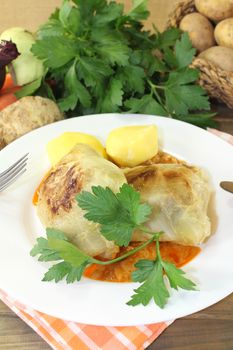 braised cabbage rolls with potatoes and parsley