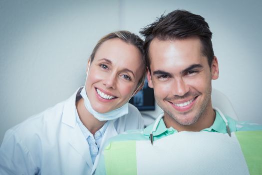 Close up portrait of two smiling dentists