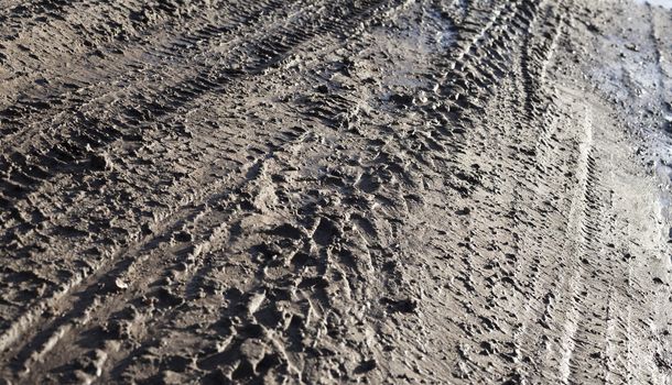 Wheel tracks on the dirt road