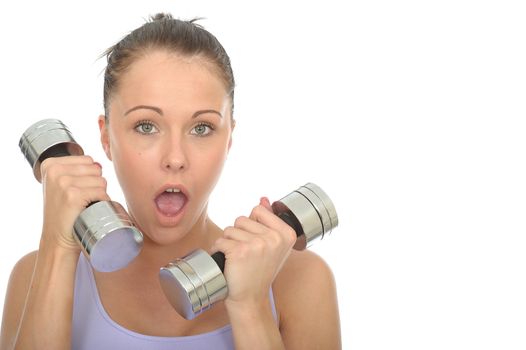 Healthy Young Woman Training With Weights Looking Shocked