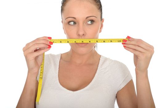 Healthy Young Woman Holding a Coloured Cloth Tape Measure
