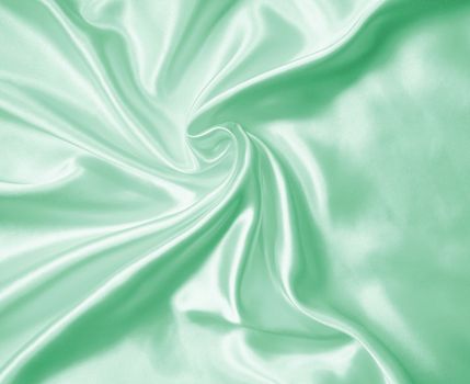 Smooth elegant green silk or satin as background 