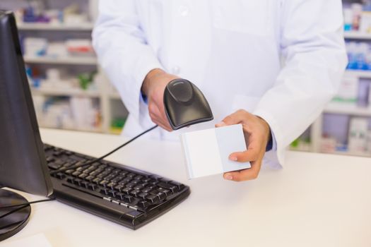 Pharmacist scanning medicines