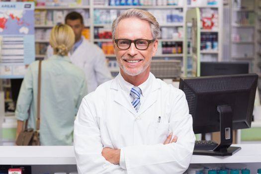 Smiling pharmacist looking at camera 