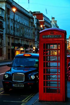Famous red telephone booth and taxi cab in London