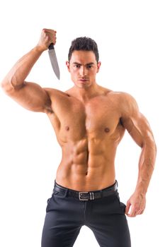 Handsome power athletic guy posing with knife