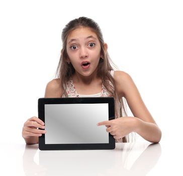 Beautiful pre-teen girl showing a tablet computer.
