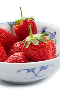 Bowl of succulent ripe red strawberries