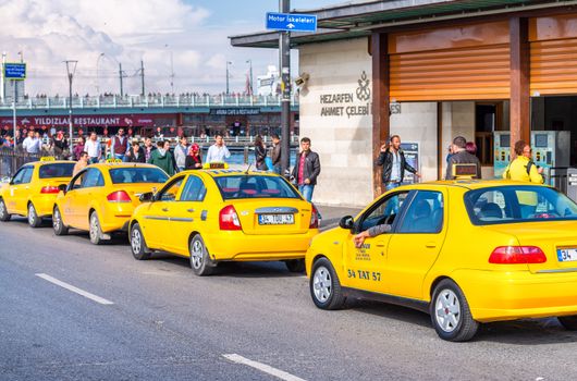 ISTANBUL - SEPTEMBER 21, 2014: Yellow taxis along city streets. 
