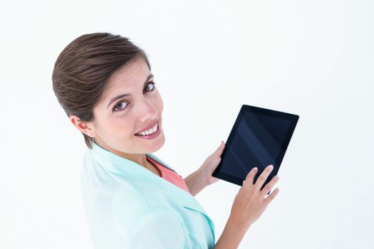 Beautiful brunette holding tablet pc 