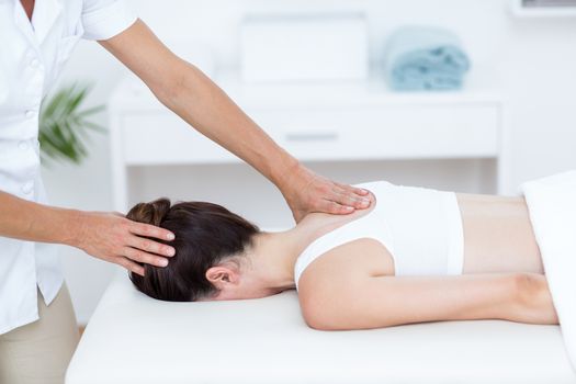 Physiotherapist doing shoulder massage 