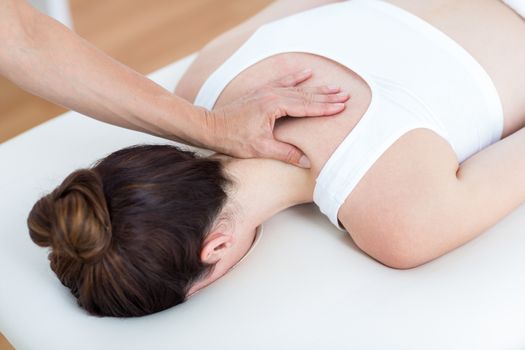 Physiotherapist doing shoulder massage 