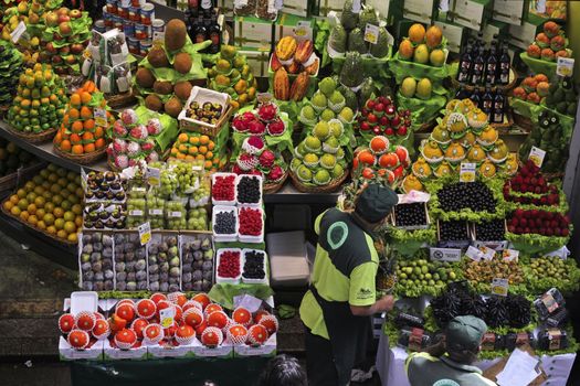 SAO PAULO/BRAZIL - MAY 9: An unidentified vendor at a fruit stand in Central Market of Sao Paulo on May 09, 2015. This landmark is a destination for tourists and locals.