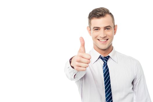 Business executive showing thumbs up gesture