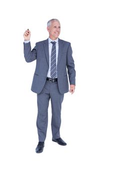 Smiling businessman pointing something with his hand