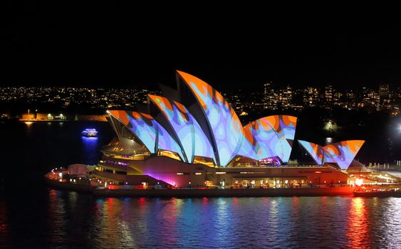 Sydney Opera House in orange and blue during Vivid Sydney