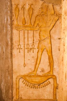 Ancient hieroglyphs carved in stone, Queen Hatshepsut temple, Eg