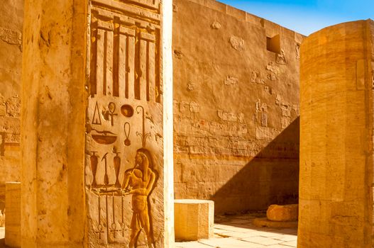 Ancient hieroglyphs carved in stone walls, Hatshepsut temple, Eg