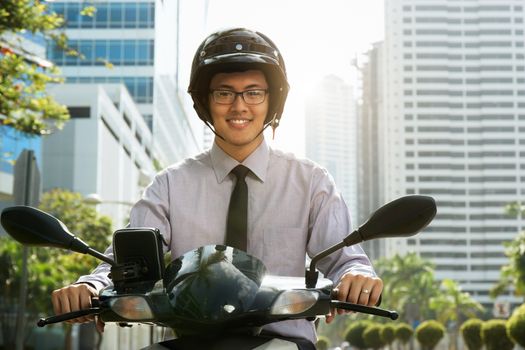 Chinese Businessman Commuter Using Scooter Motorcycle In City