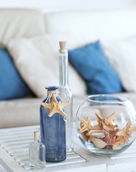 Idea of interior decoration with starfishes and glass bottles