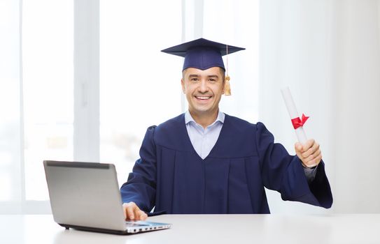 smiling adult student in mortarboard with diploma
