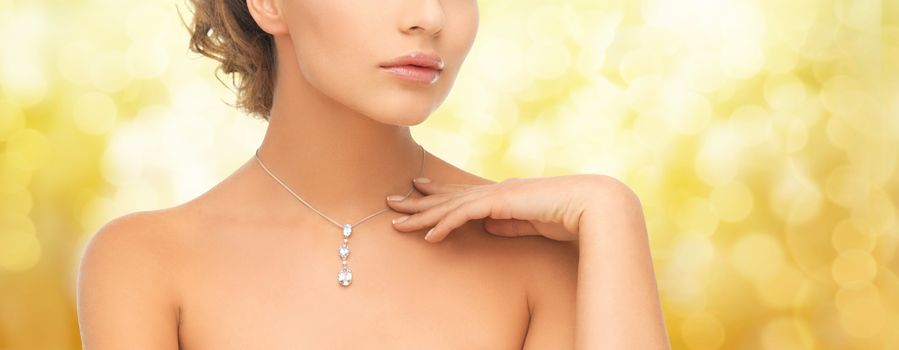 woman wearing shiny diamond pendant
