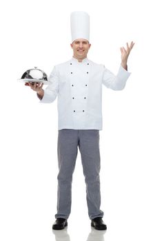 happy male chef cook holding cloche