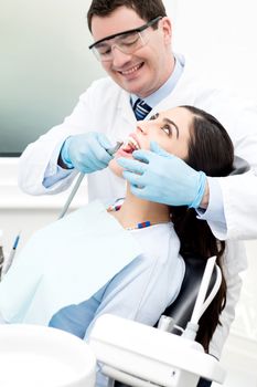Dentist examine on a female patient