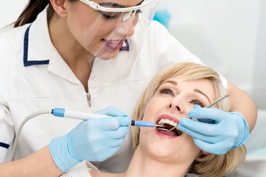 Woman under a dental treatment.