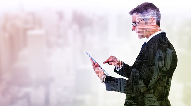 Composite image of mid section of a businessman touching tablet